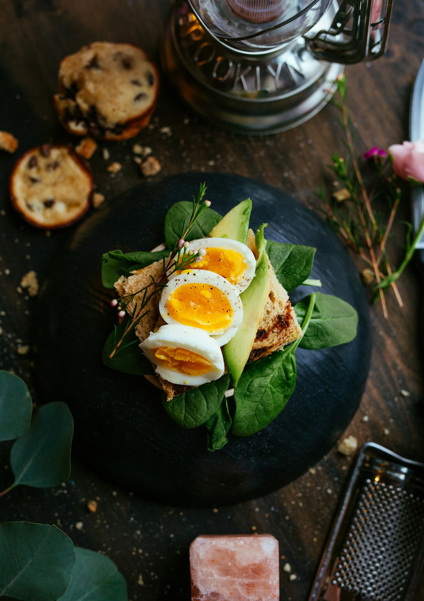 Egg and avocado toast on a wooden board