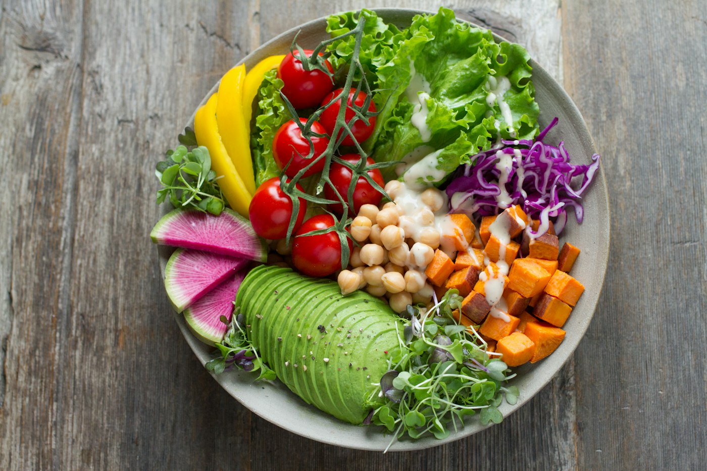A colorful grain bowl with vegetables
