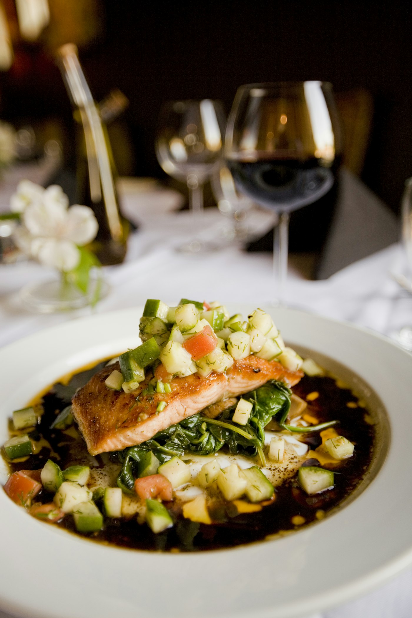 Salmon served with greens and grains